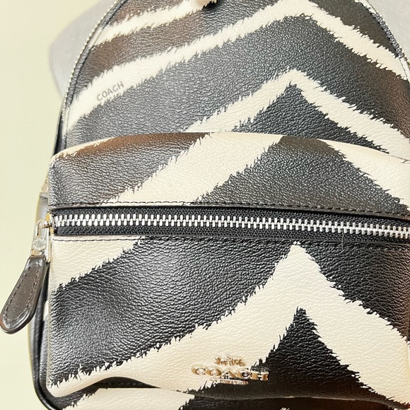 Coach Zebra MN CHRLE 39033 SV/BLACK
Coach Mini Charlie Women's Zebra Print EC - Picture 15 of 16